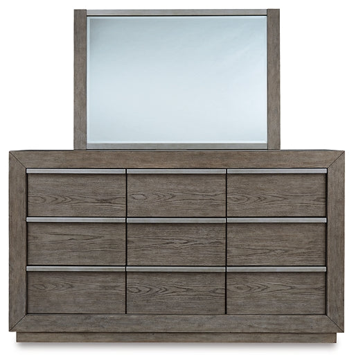 Anibecca Queen Upholstered Panel Bed with Mirrored Dresser, Chest and Nightstand