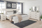 Stelsie King Panel Bed with Mirrored Dresser and Nightstand
